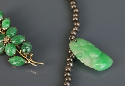 Necklace with silver beads holding engraved...