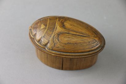 A covered straw marquetry box in the shape...