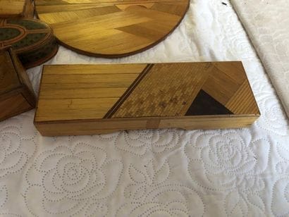 A covered straw marquetry box in the shape...