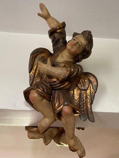 Two carved wood putti with polychrome decoration...