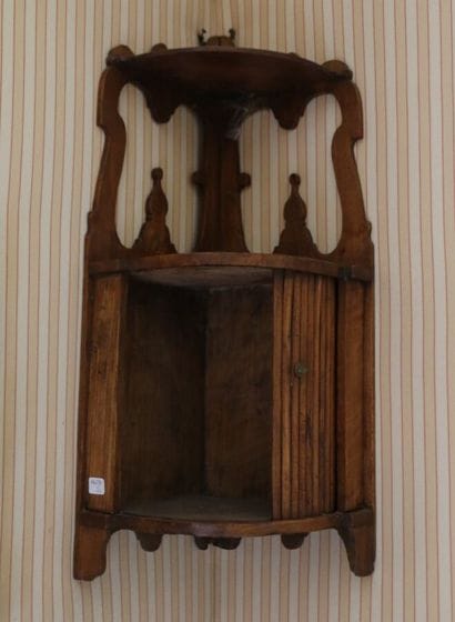Natural wood sconce opening with a curtain.
19th...