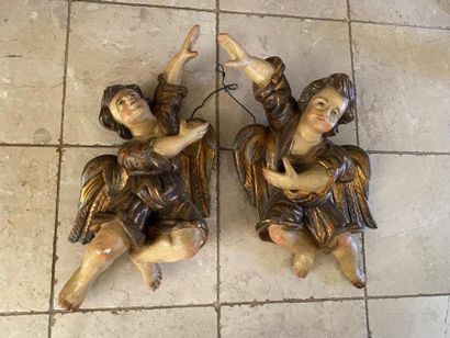 Two carved wood putti with polychrome decoration...
