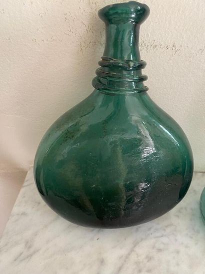 Set of three high-necked globular carafes...