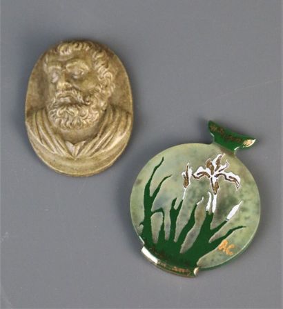 Lava stone medallion with carved decoration...