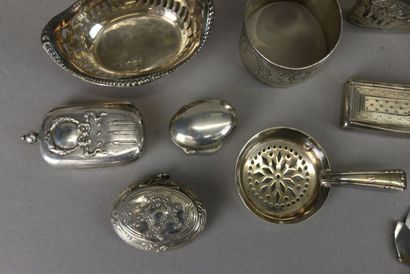 Set of silver display items including: pyrogen...