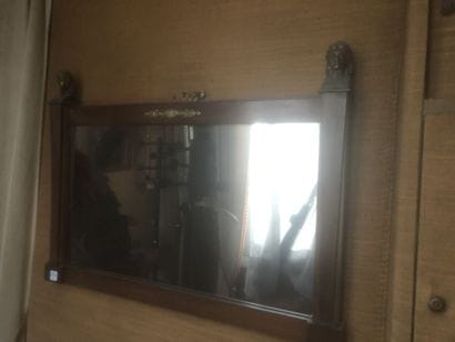 Mahogany veneered mirror with bronze heads.
Empire...
