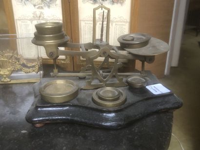 Scales, a brass socket, a glass and brass...