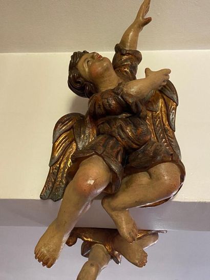 Two carved wood putti with polychrome decoration...