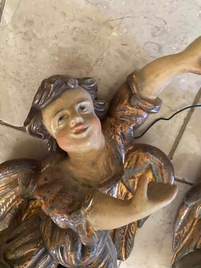 Two carved wood putti with polychrome decoration...