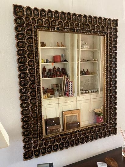 Large mirror, the rim adorned with painted...
