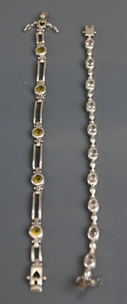 Two silver bracelets set with fancy stones....