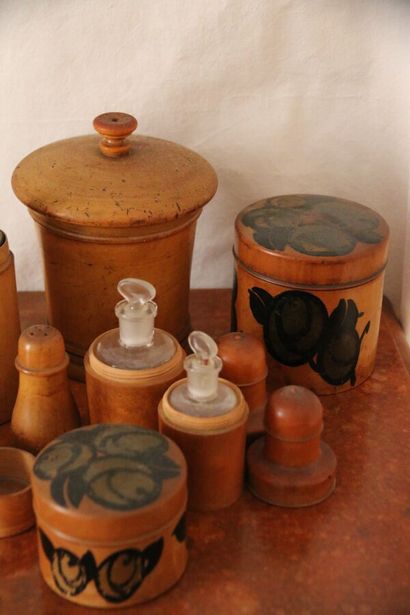 Nine boxwood boxes, two of which are painted...