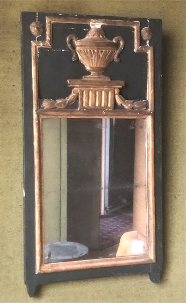 Mirror in patinated and gilded wood, the...