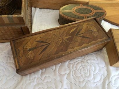A covered straw marquetry box in the shape...