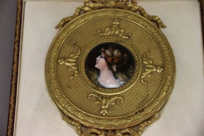Gilt bronze hand mirror, the circular bevelled...