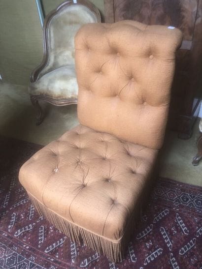 Fireside chair, upholstered in brown fabric....