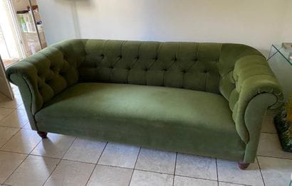 Chesterfield-style upholstered sofa in green...