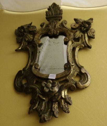 Carved and gilded wood mirror with foliate...
