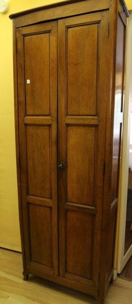 Molded walnut cabinet opening with two doors.
H:...