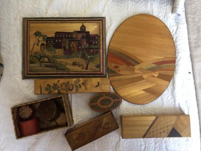 A covered straw marquetry box in the shape...
