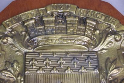 Embossed brass shield with the coat of arms...