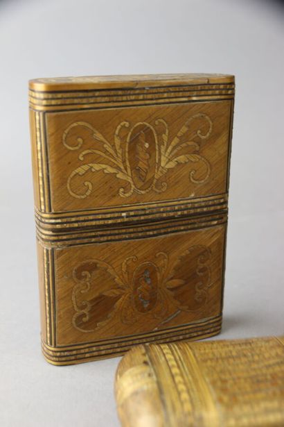 Two straw marquetry cases and a cigar holder...