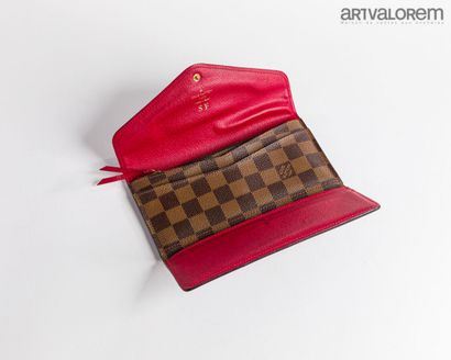 LOUIS VUITTON
Wallet in ebony checkerboard...