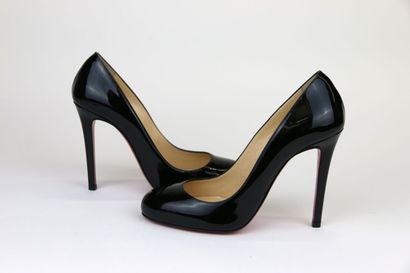 LOUBOUTIN
A pair of black patent leather...