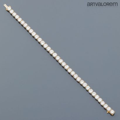 River bracelet in 750°/°° yellow gold adorned...
