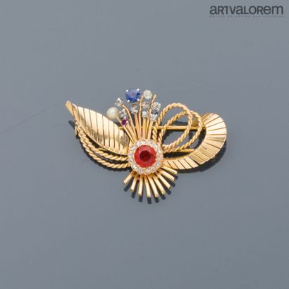 Brooch in yellow gold 750°/°° in the form...