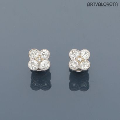 Pair of 750°/°° white gold four-lobed stud...