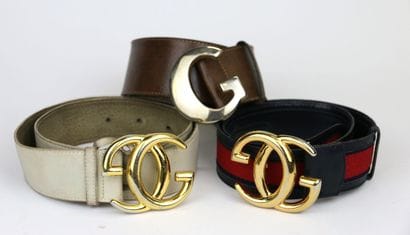 GUCCI - Made in Italy
Three belts with gilded...