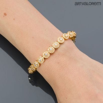 Bracelet in yellow gold 750°/°° with circular...