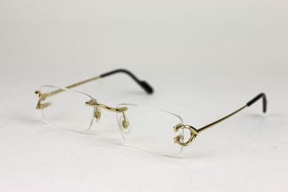 CARTIER
Pair of gilded metal eyeglasses
In...
