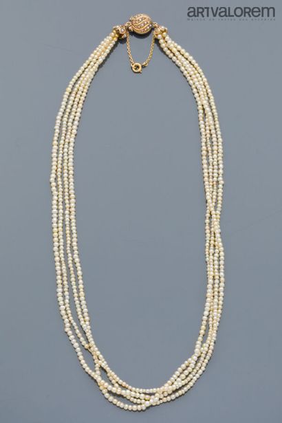 Necklace composed of four rows of round and...