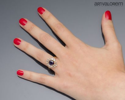 Ring in yellow gold 750°/°° centered on a...