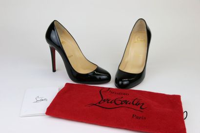 LOUBOUTIN
A pair of black patent leather...