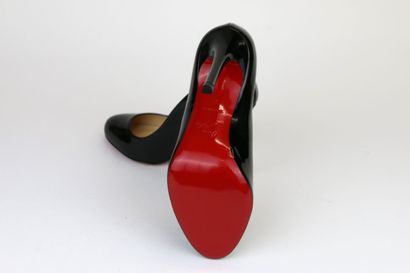 LOUBOUTIN
A pair of black patent leather...