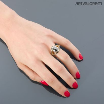 Yellow and white gold 750°/°° ring centered...