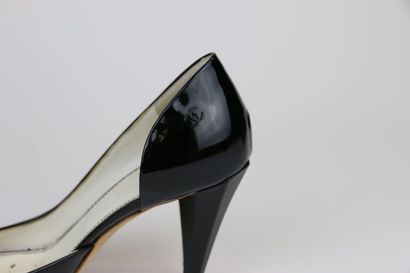 CHANEL
Pair of black patent pumps, open toe....