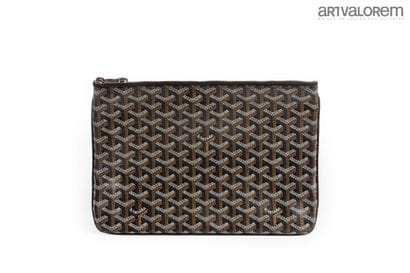 GOYARD
Coated canvas pouch with black background
Yellow...