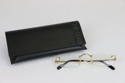 CARTIER
Pair of gilded metal eyeglasses
In...