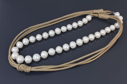 Long necklace adorned with white freshwater...
