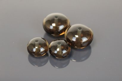 One round faceted smoky quartz and four smoky...