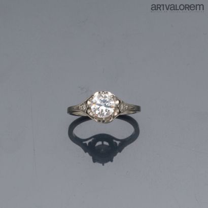 Platinum solitaire set with a claw-set brilliant-cut...