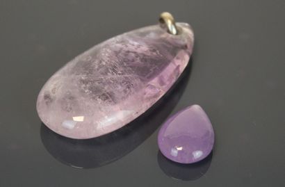 Two drop-cut amethysts, the larger one mounted...