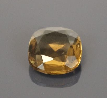 One round faceted smoky quartz and four smoky...