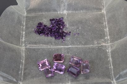 7 lilac-colored emerald-cut amethysts 
one...
