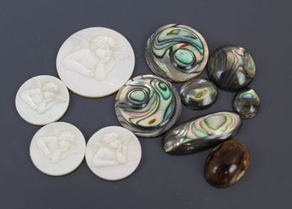 Four circular mother-of-pearl plates engraved...