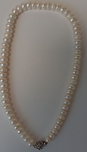 Fallen cultured pearl necklace with metal...